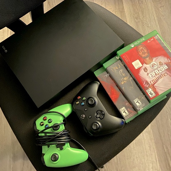Selling a Xbox one x with 2 controllers and 3 games. Good condition